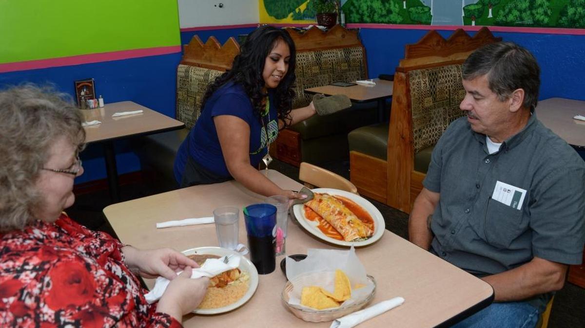 Rosa Mendoza serves Cynthia and Ernest Martell lunch at Los Cantaritos Mexican Restaurant at 3040 Northwest Ave. near Yeager's in Bellingham, Thursday, Aug 18, 2016.