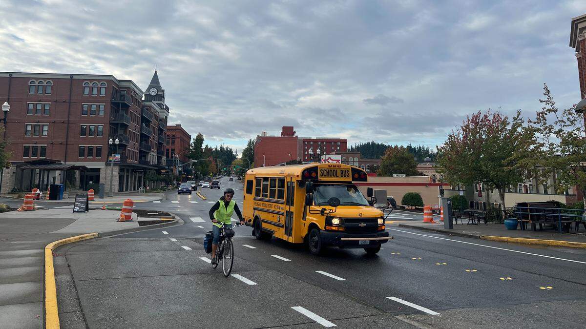Traffic heads north where 12th Street becomes Finnegan Way at the corner of Mill Avenue in the Fairhaven district of Bellingham.