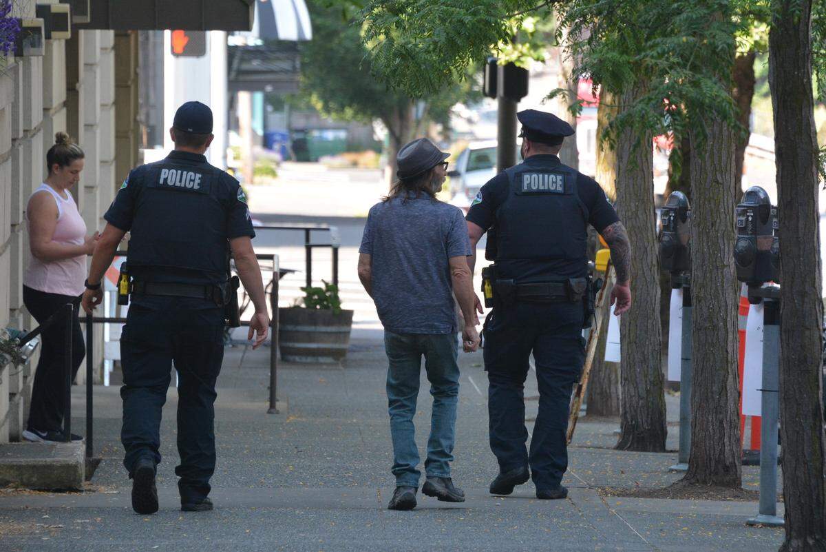 Two Bellingham Police officers patrol Cornwall Avenue south of East Holly Street in 2023. 