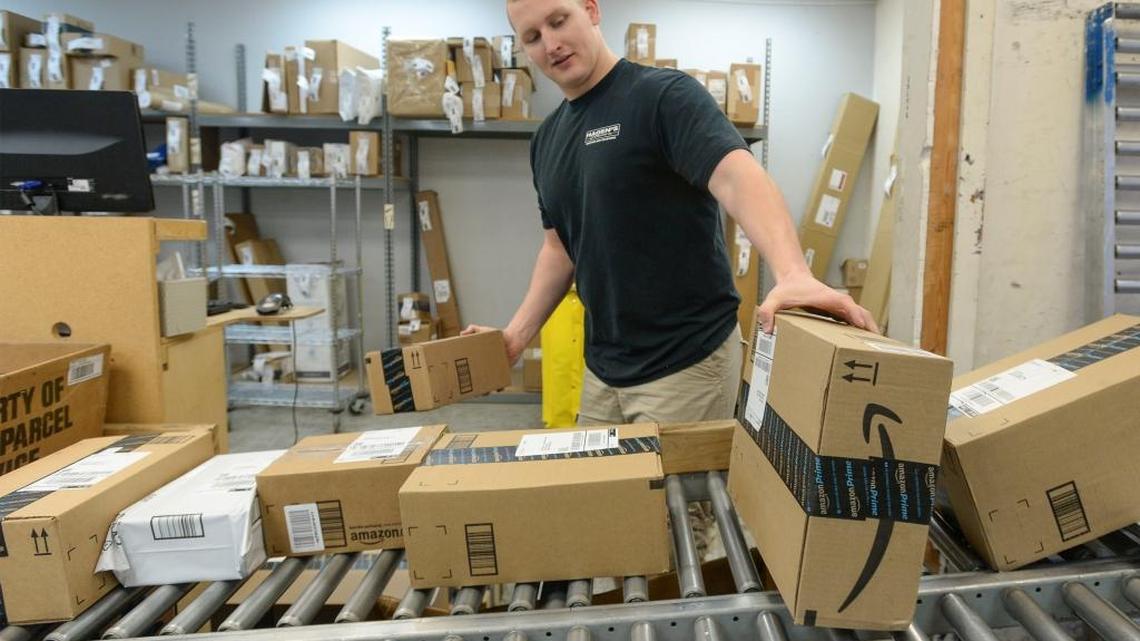 Steven Elsner unloads a direct shipment from Amazon at Hagen’s of Blaine, a shipping and receiving business, on Thursday, March 24, 2016.