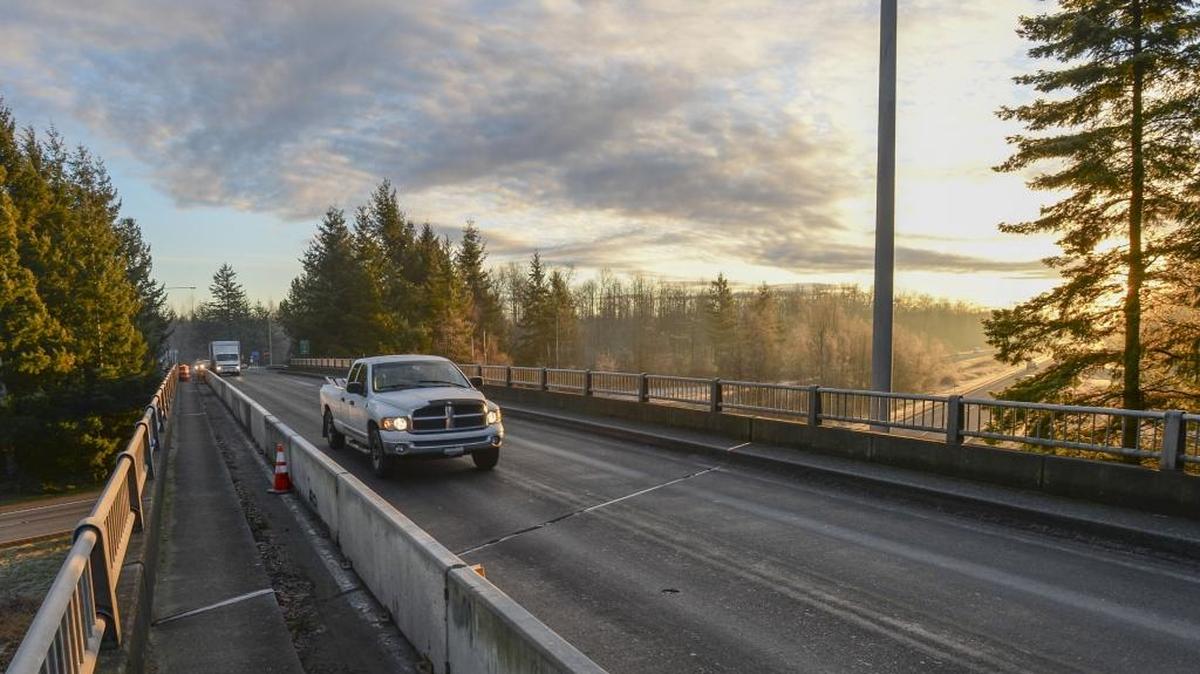 Cars travel over the Birch Bay-Lynden overpass over Interstate 5 on Jan 15, 2016. Work is ongoing to repair the bridge that was damaged last May.