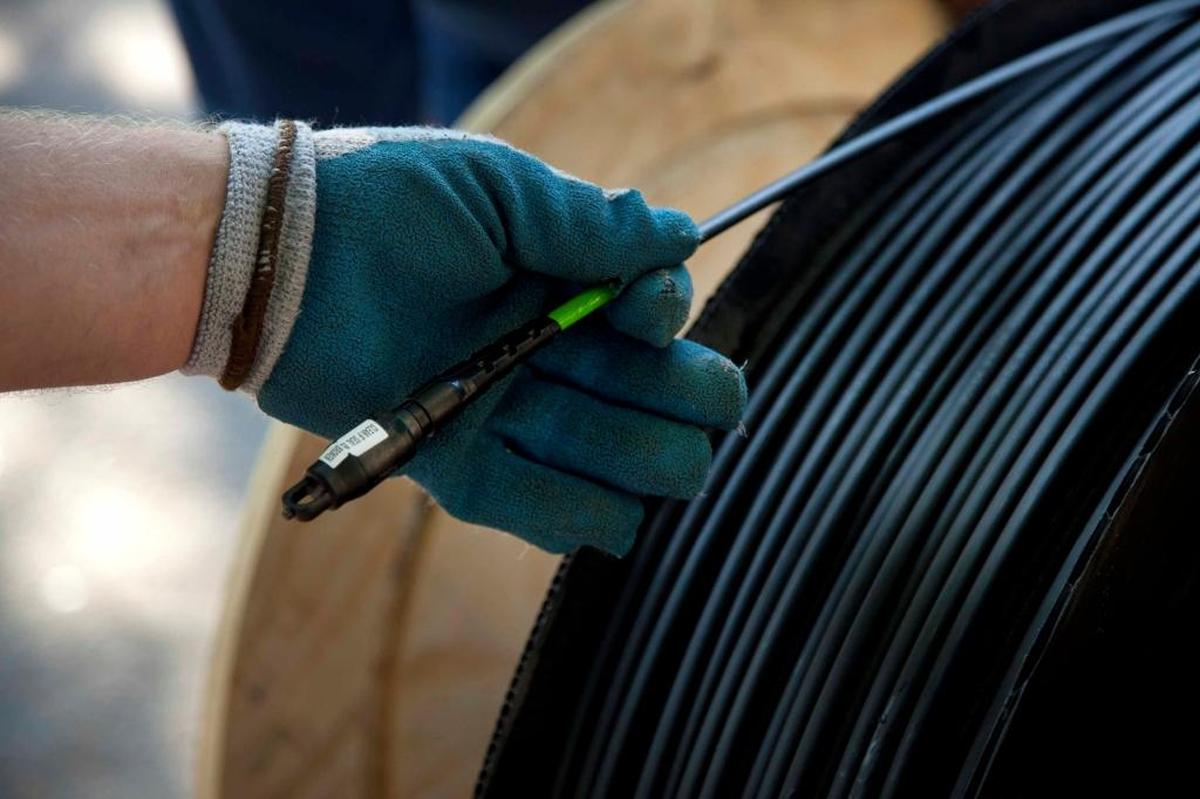 A spool of fiber optic cable during installation.