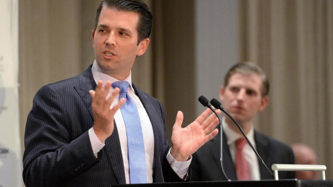 Donald Trump Jr., left, speaks as his brother Eric looks on during speeches at the grand opening of the Trump International Hotel and Tower in Vancouver, B.C., on Tuesday, Feb.28, 2017.