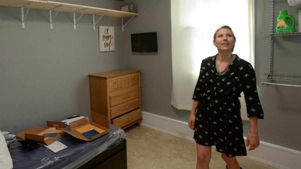 Emily O’Connor, executive director of Lydia Place, checks out one of the five rooms on Friday, May 12, 2017, that are opening up for homeless women and their young children in the Bell Tower, a former church built in 1902 in Bellingham.