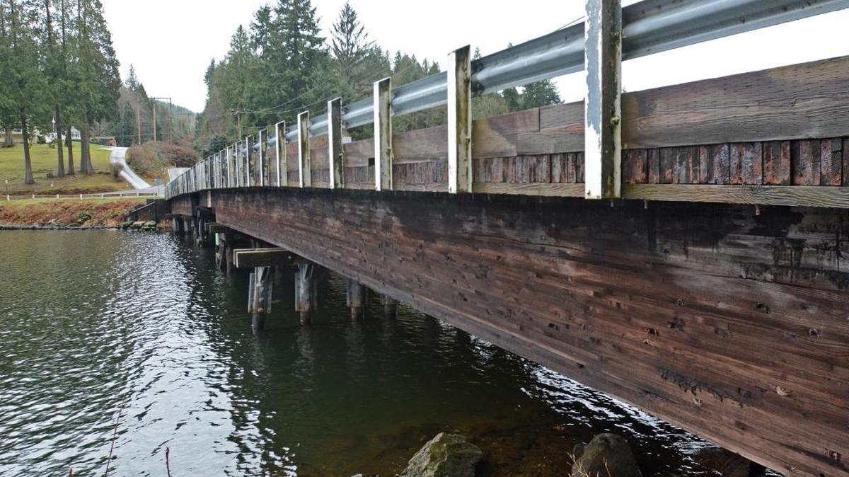 The bridge over North Lake Samish is shown Thursday, Jan. 28, 2016. In their most recent inspection, Whatcom County workers discovered rot in the laminated girders that support the bridge deck. The county is dropping the load rating of the bridge and plans to reduce traffic to one lane.