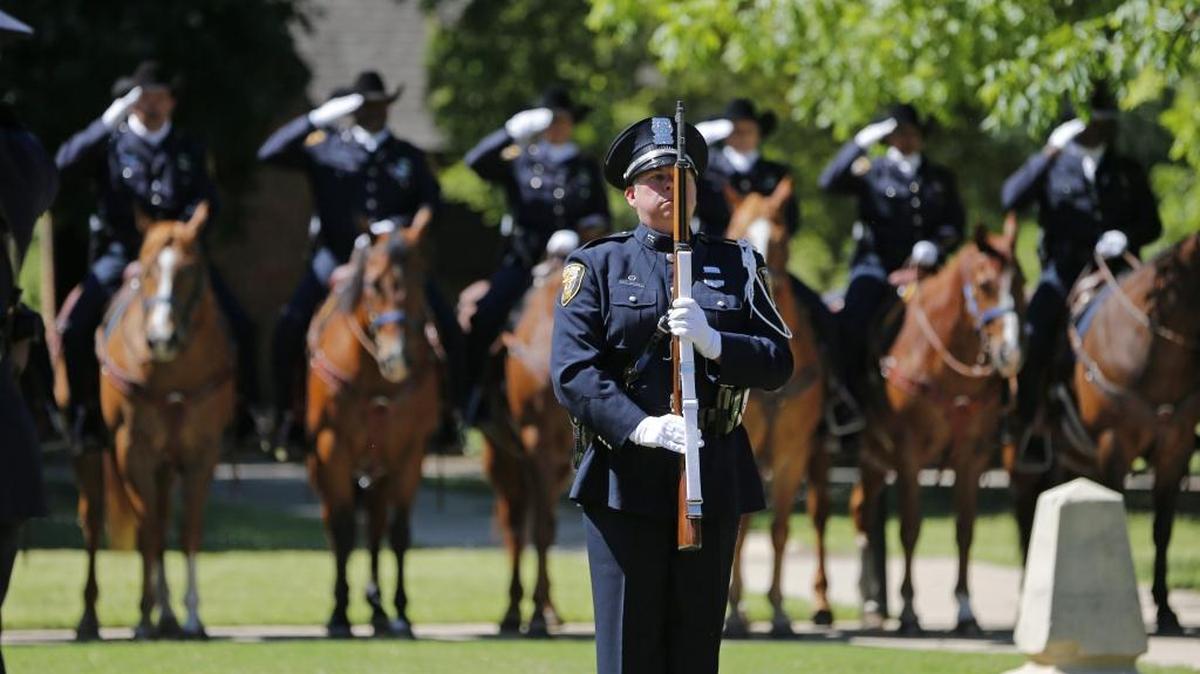 The Honor Guard and Mounted Patrol Unit salute at the Fort Worth Police Department annual Peace Officers Memorial Service on May 4, 2016. The Bellingham Police Department will hold its own vigil Sunday, May 15, for all U.S. officers killed on duty in 2015.