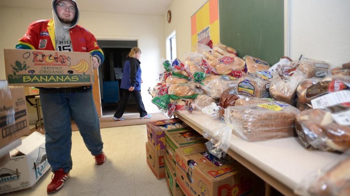 Mount Baker High School Life Skills Transitions student Matt Hanson brings in a box of donated bread to the Foothills Food Bank at St. Peter Catholic Church east of Deming Monday morning, Feb. 1, 2016. The transitions students volunteer every Monday and Tuesday, unloading, sorting and delivering food at the food bank. The food bank will move to the East Whatcom Regional Resource Center when a second building there is constructed.