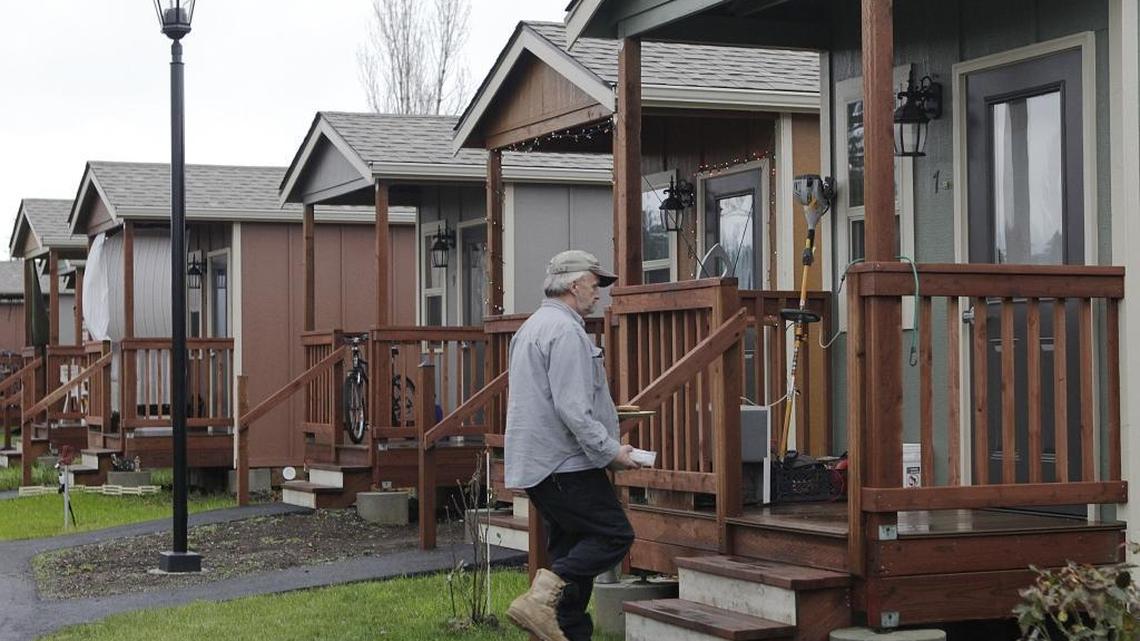 Walking to his cottage Dec. 23, 2014, Byron Thorp views his move to Quixote Village in Olympia as a literal life-saver, helping him to break away from a drug habit he’d battled in the past.