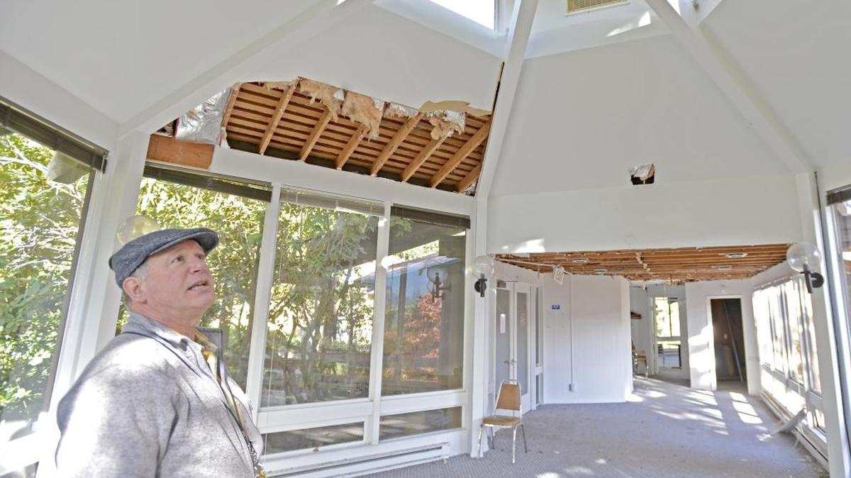 Mitch Waterman, managing director of Sudden Valley, looks at the ceiling of the community rotunda building Oct. 23, 2015. The community rejected dues increases that would have paid for repairs.