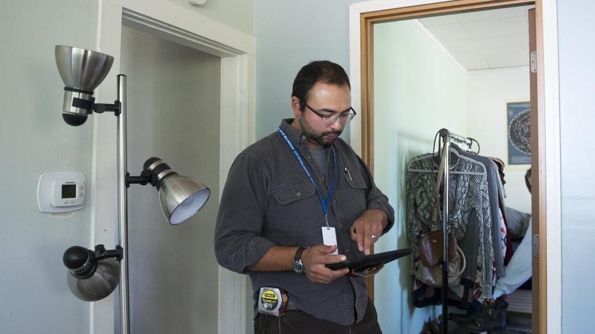 Rob Barker, building inspector with the City of Bellingham, works through a rental follow-up inspection in the 500 block of Boulevard on Tuesday, Sept. 20, 2016, in Bellingham.