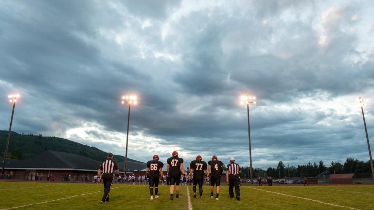 From left to right, Mount Baker's Gene Fleming, T.J. Bass, Braxton Shannon and Jed Schleimer walk to the middle of the field for the coin toss before a 44-36 victory over Nooksack Valley on Friday, Sept. 23, 2016 at Mount Baker High School in Deming.