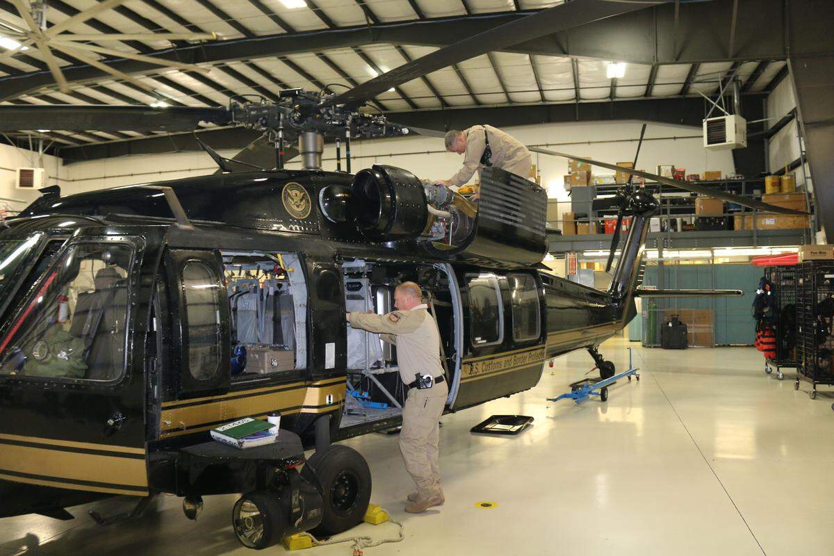 A U.S. Customs and Border Protection crew out of Bellingham prepares a UH-60 Black Hawk o help conduct search and rescue, recovery and relief efforts in areas affected by Hurricane Florence.