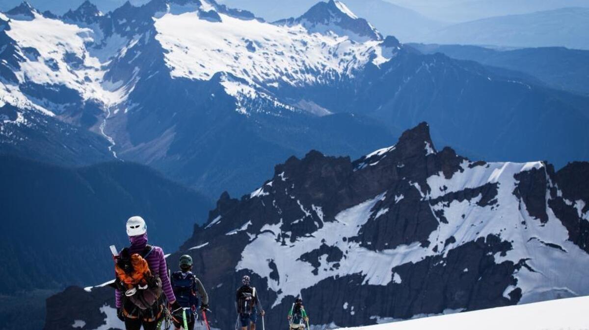 Twelve runners make their way back from the10,781-foot summit of Mount Baker on June 4, 2016. They were taking part in the Mount Baker Ultra Run, a 108-mile run, hike and climb from Bellingham Bay to Mount Baker and back. Eleven completed the tough trek.