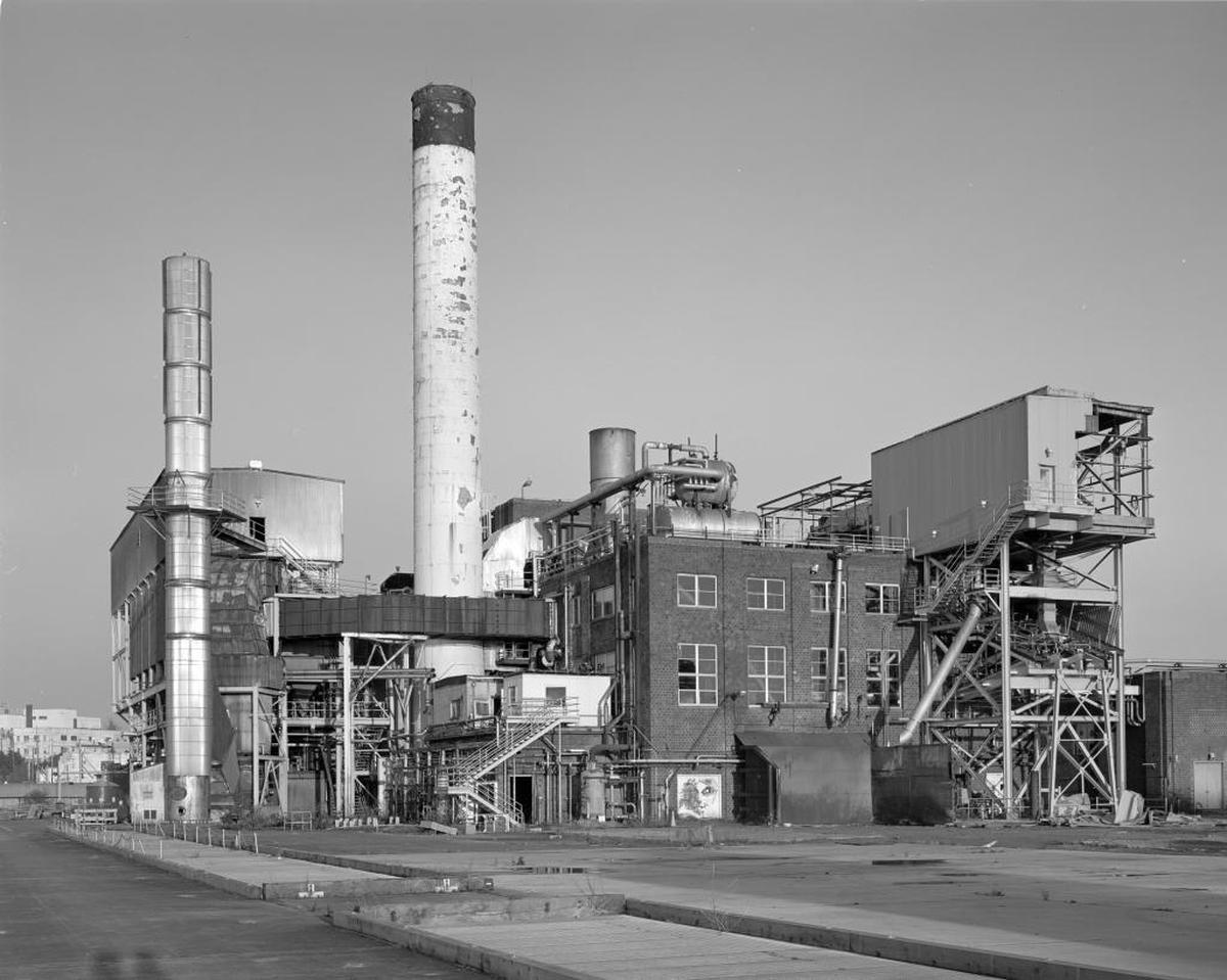 The steam plant building at the Georgia-Pacific waterfront mill site, photographed in 2008, was demolished in 2011 after the waterfront tissue mill was closed in 2007. In 1987, the skeletal remains of a still-unidentified person were found in the chimney there, which was in the squat steel box nestled close to a brick wall and support structures.