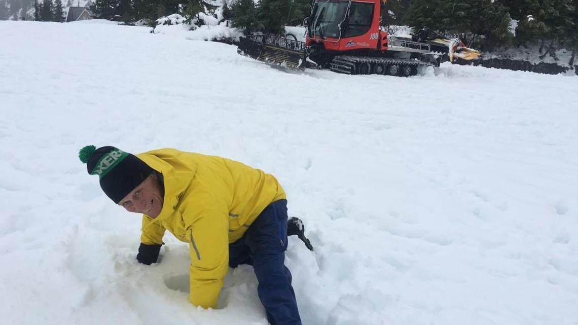 Duncan Howatt, general manager of the Mt. Baker Ski Area, illustrates the depth of snow at the top of Chair 2 on Sunday afternoon.