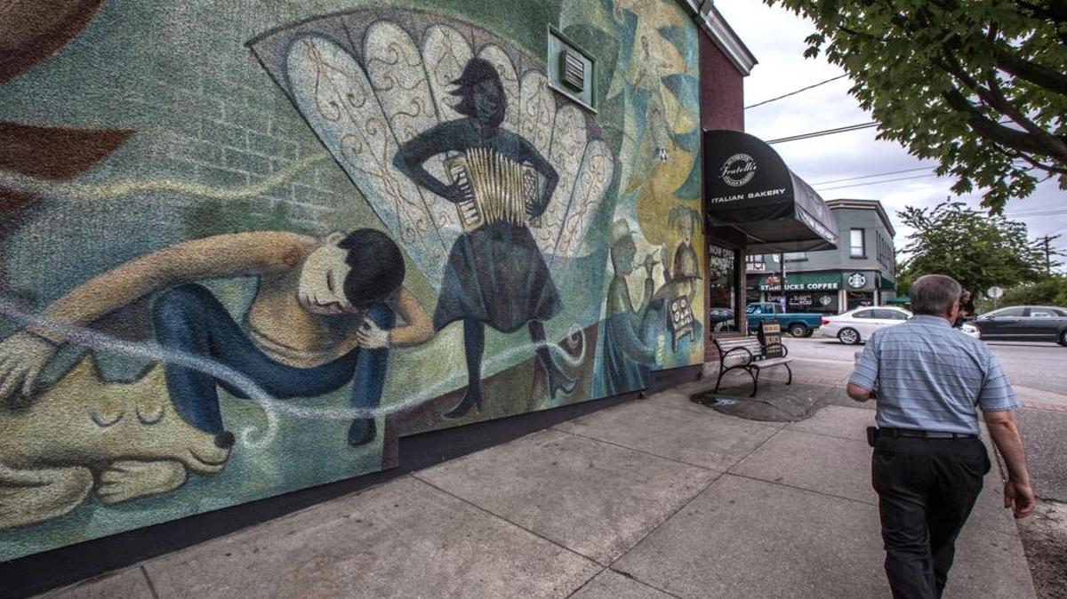 A mural adorns a side street just off Commercial Drive, a funky street for shopping, eating and people-watching in East Vancouver, B.C. With the Canadian dollar lagging, more Americans are heading north of the border to visit.