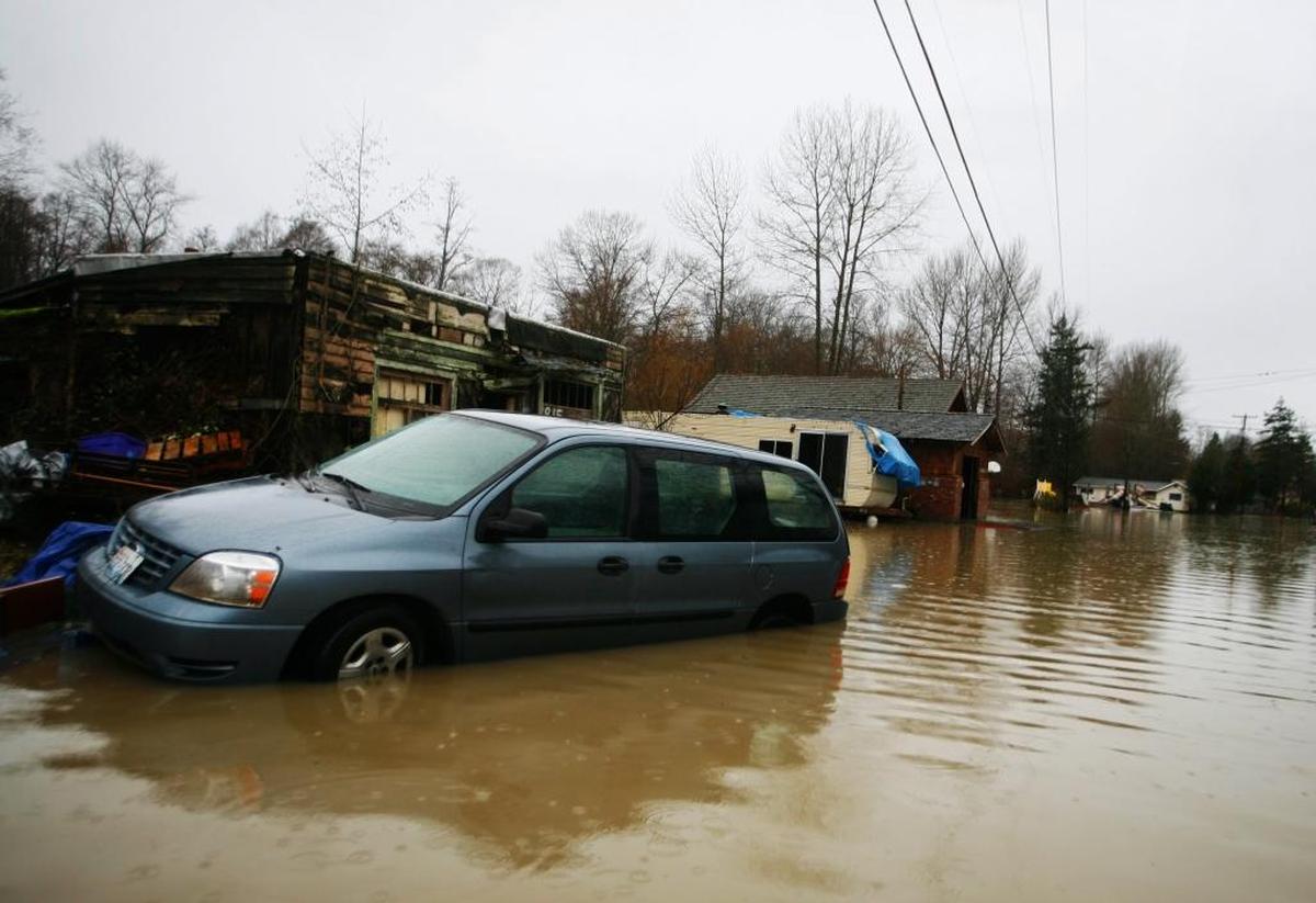 A van is partially submerged in Marietta on in January 2009. Paul Gazdik, Bellingham’s emergency management coordinator, says to follow the saying: “Turn around, don’t drown,” that driving in floodwaters is not safe.
