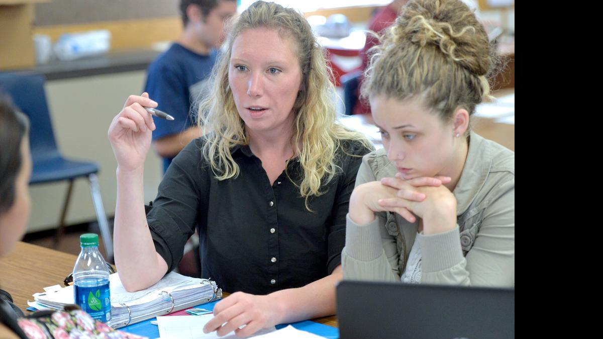 
Options High School teacher Michelle Wilhelm works with students in her English class on a poetry anthology at the school in Bellingham on Tuesday, June 16, 2015. At right is student Lavaun Vermeulen.
