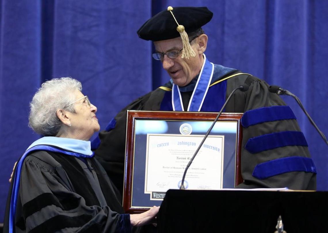 Holocaust survivor Noemi Ban, left, receives an honorary doctorate of Humane Letters from Western Washington University President Bruce Shepard during the winter 2013 commencement at Western. Ban was also the commencement speaker.