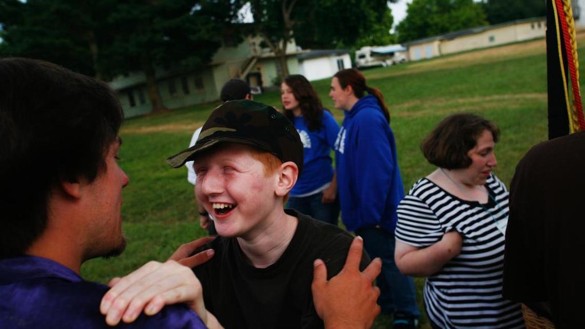 Counselor Josh Honrud, left, laughs with camper Tyrell Janning, 13, following a hot air balloon show at Camp Horizon in Birch Bay in 2008.