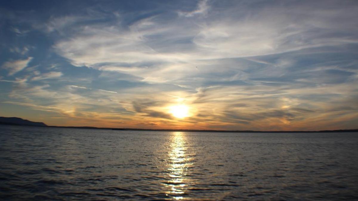 Cirrus and cirrostratus clouds fill the sky over Bellingham Bay.