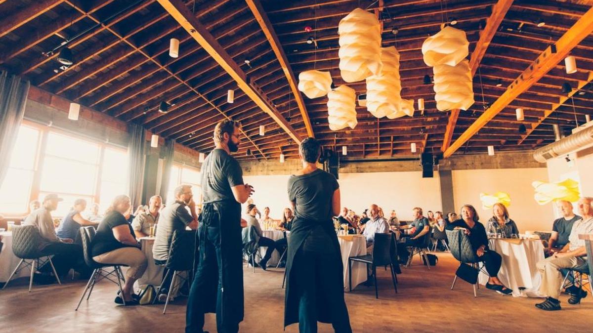 Ciao Thyme owners Mataio and Jessica Gillis address the crowd at their Uncommon Pairing dinner, which capped off Bellingham Beer Week last September. The company is planning to expand its use of the event room, known as Ciao Thyme Commons.