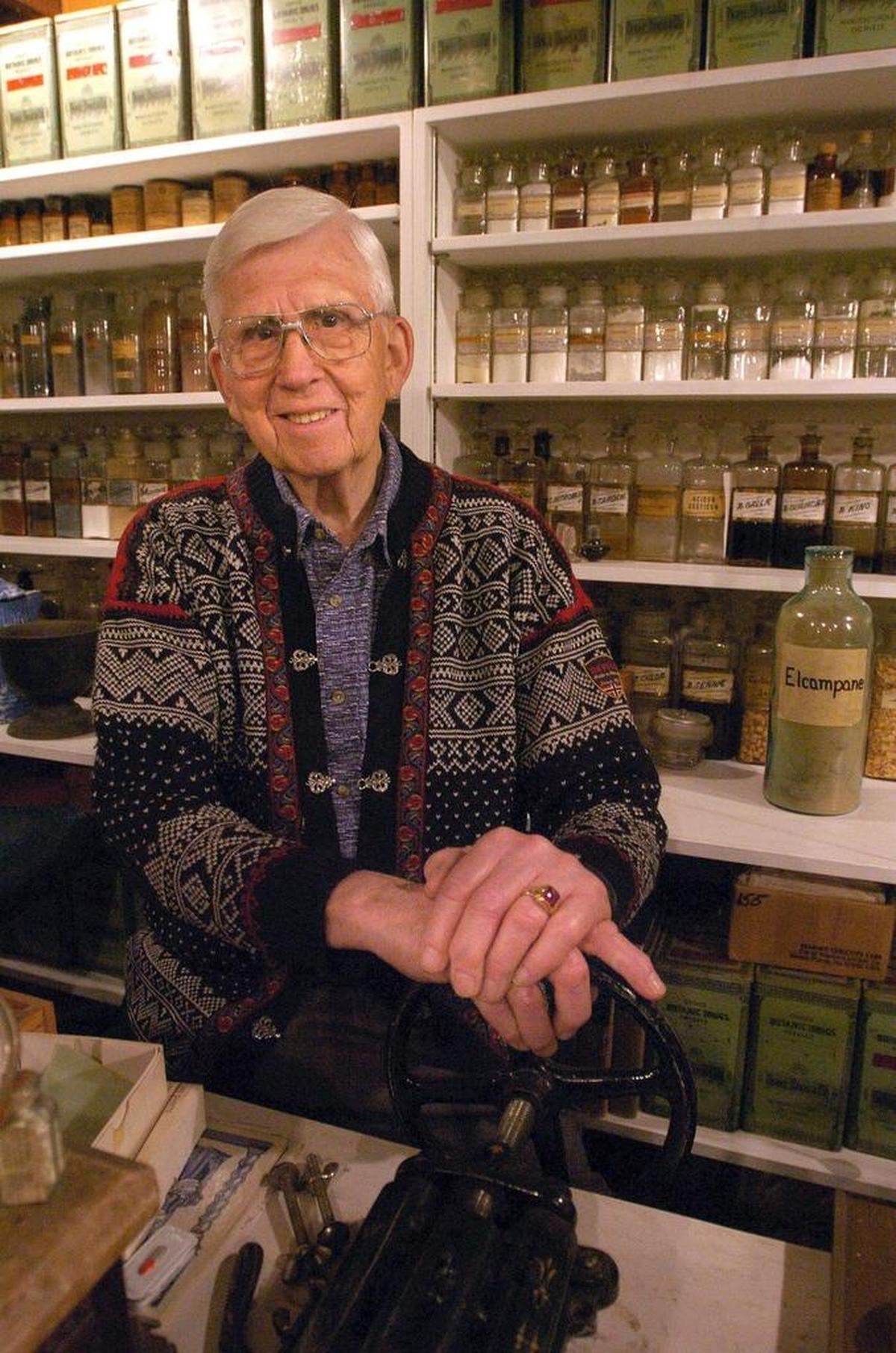 Gordon Tweit posed with his museum-like collection in the basement of Fairhaven Pharmacy in May 2005, the year he was grand marshal in the Ski to Sea Parade.