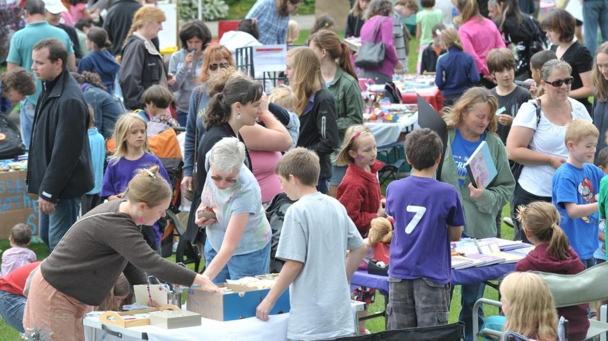 Visitors browse the vendors’ tables at the Children’s Craft Fair in 2012.