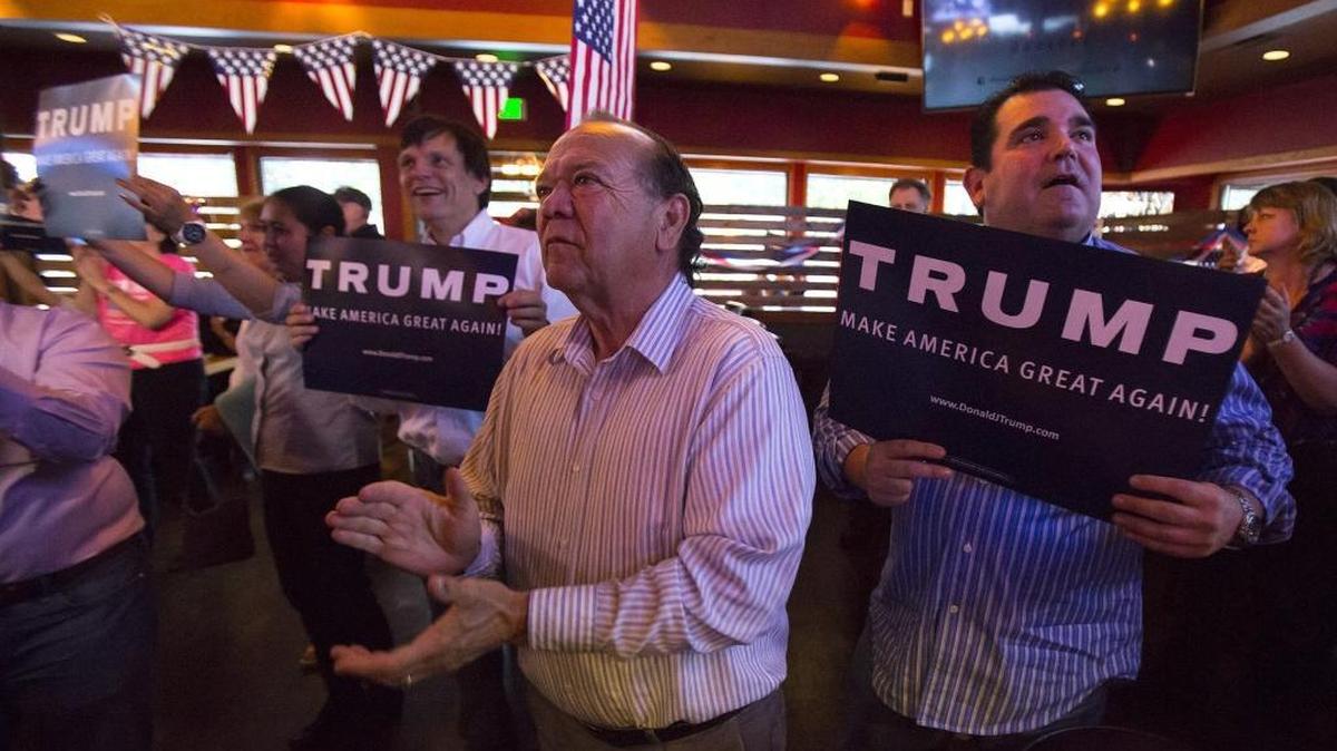 Washington residents celebrate primary results showing a wide-margin victory for Republican presidential candidate Donald Trump on May 24, 2016, in Lynnwood, Wash.