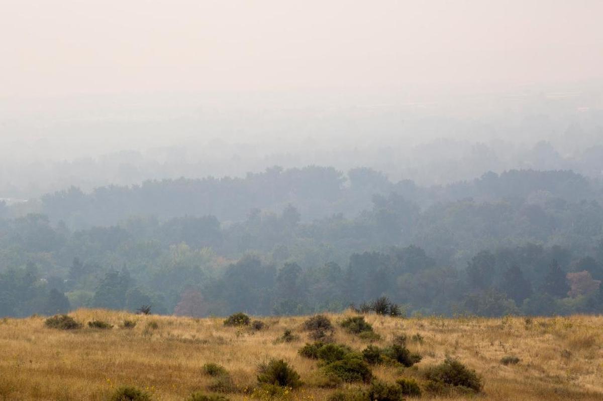 The smoke lies thick across City of Trees looking southeast from the Boise, Idaho foothills Tuesday, Sept. 5, 2017. Wildfires burning in western U.S. states sent smoke into cities from Seattle to Denver, prompting health warnings and cancellations of outdoor activities for children by many school districts.