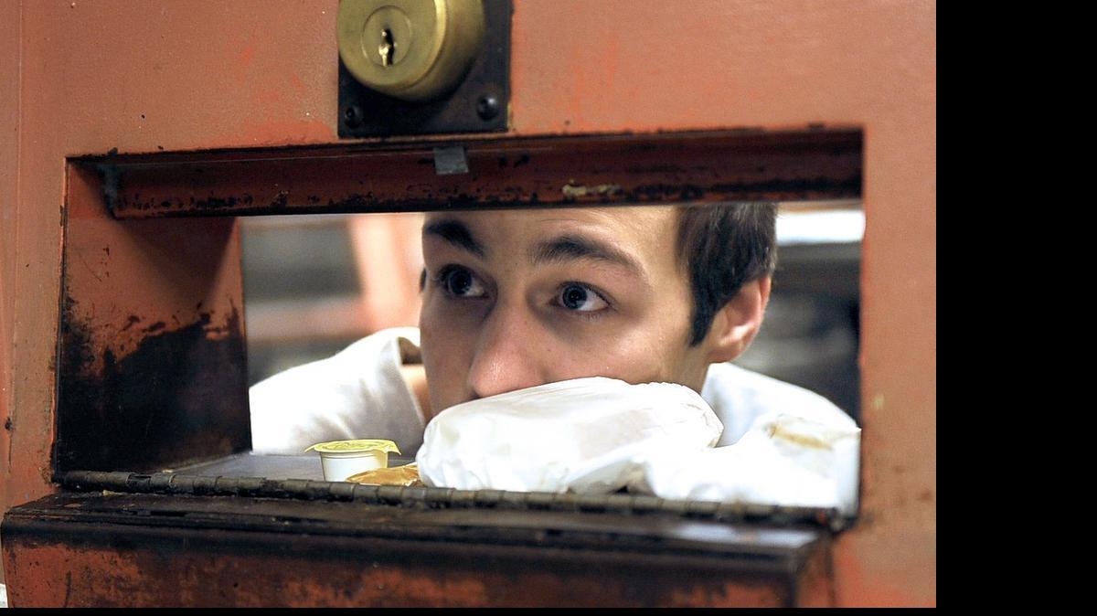 Inmate Brian Terris gets lunch in cell block C at the Whatcom County Jail Thursday, March 26, 2015, in Bellingham.