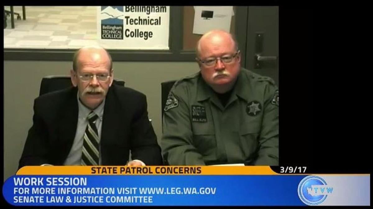 Whatcom County Prosecutor Dave McEachran, left, and Sheriff Bill Elfo testify via a video call before the state Senate Law and Justice Committee Thursday morning. Much of the committee’s work session focused on the challenges officials faced responding to a protest last month that blocked the northbound lanes of Interstate 5 in Bellingham.