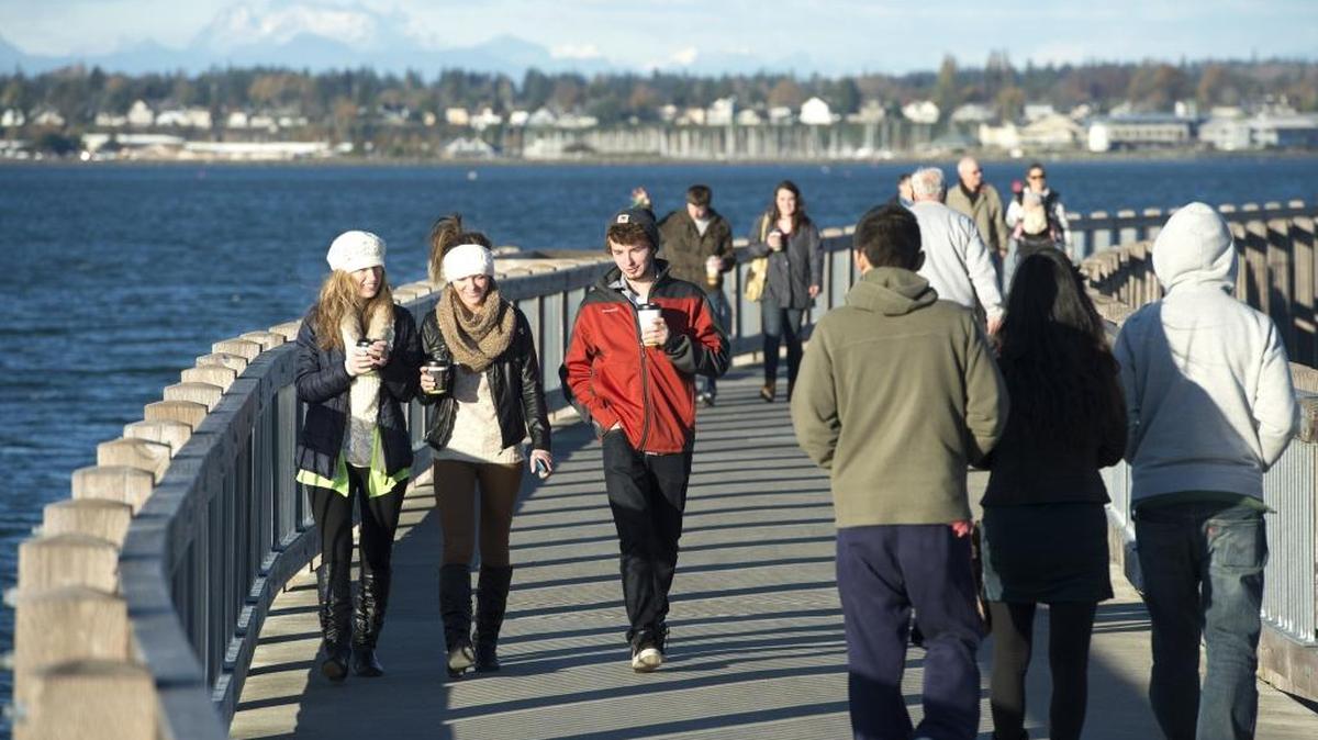 From left to right Luda Derkach, Inna Derkach and Oleg Zakkurdayev stroll down Taylor Dock in 2014. National Geographic Travel released its list of the small cities (population less than 600,000) in the United States that provide the best coffee fix, and Bellingham made the top 10.