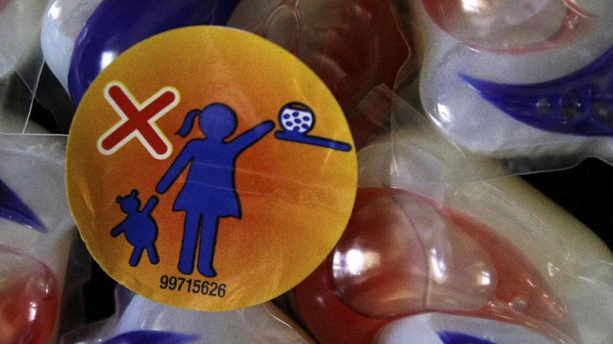 A label is attached to a package of laundry detergent packets warning of the danger to children. Teens are eating laundry detergent pods and posting the videos of themselves on social media, and doctors warn it could be dangerous.