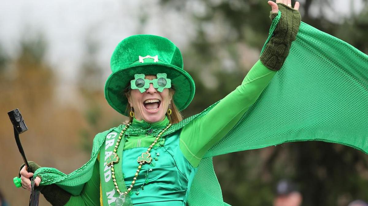 St. Patrick’s Day Parade grand marshal Tammy Bennett waves to the crowd March 16, 2013, in Bellingham.