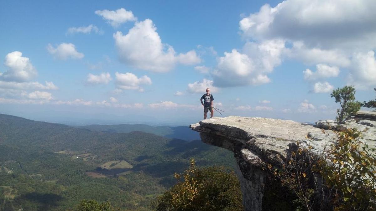 Ken Wilcox, author of “Hiking Whatcom County,” stands on McAfee Knob in Virginia in 2013. The view is one of the most photographed spots on the Appalachian Trail. A new edition of his hiking guide book will publish in mid-May.