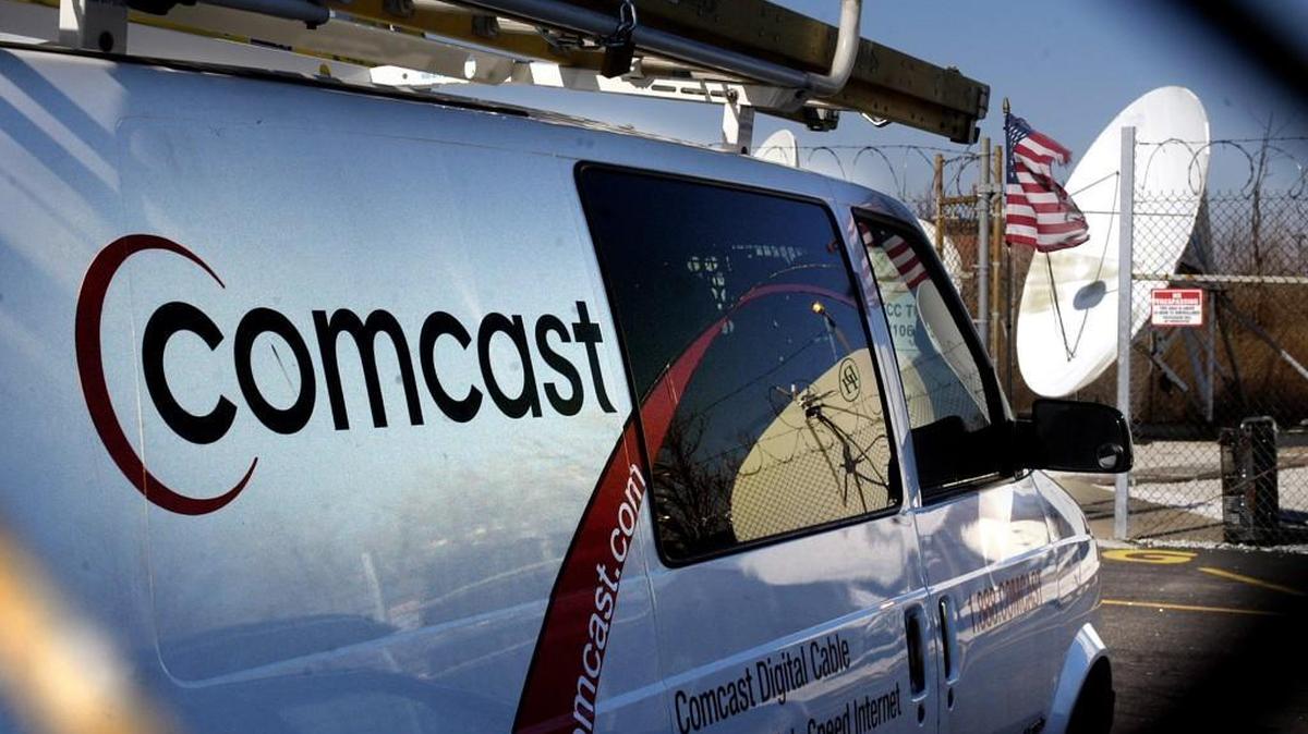 Comcast Cable TV vans are parked in Comcast Corp. offices in South Philadelphia, Pennsylvania, Wednesday, February 11, 2004. Comcast is increasing speeds statewide for two of its more popular internet tiers.