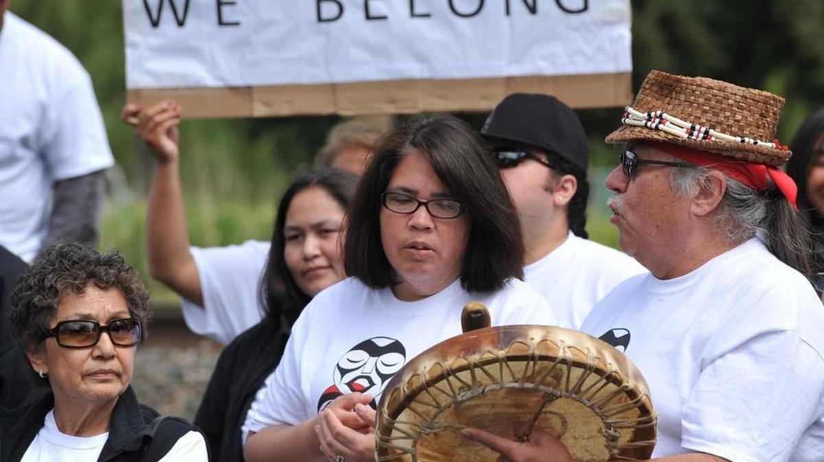 George Adams, right, sings with a crowd of dozens as they await a decision on whether the disenrollment process of 306 Nooksack Indian Tribe members will be allowed to proceed in 2013, in front of the Nooksack Tribal Court in Deming. Tribal Council Chairman Bob Kelly said in a news release Nov. 23, 2016, that 289 “non-Indians who had erroneously been enrolled in the Tribe” beginning in 1983 were no longer members of the tribe.