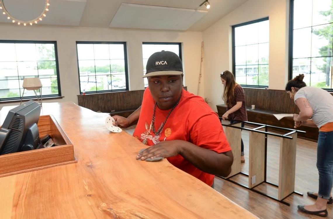 Yolanda Chinn, left, sands a new maple counter while Raelynn Sheridan and Theresa Tucci build a shelf at the new restaurant, The Birch Door Cafe near Holiday Inn Express on Meridian Street in Bellingham, Thursday, June 15, 2017. The restaurant is opening soon and will serve breakfast and lunch.