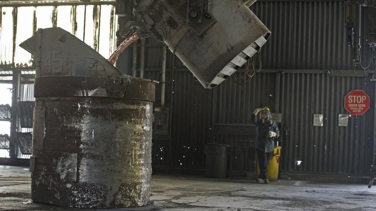 Suzi Pickett, pot operator, pours metal Oct. 25, 2013, at Alcoa Intalco Works in Ferndale. On May 2, 2016, Alcoa and the Bonneville Power Administration announced a finalized power agreement that will keep the smelter operating until at least Feb. 24, 2018.