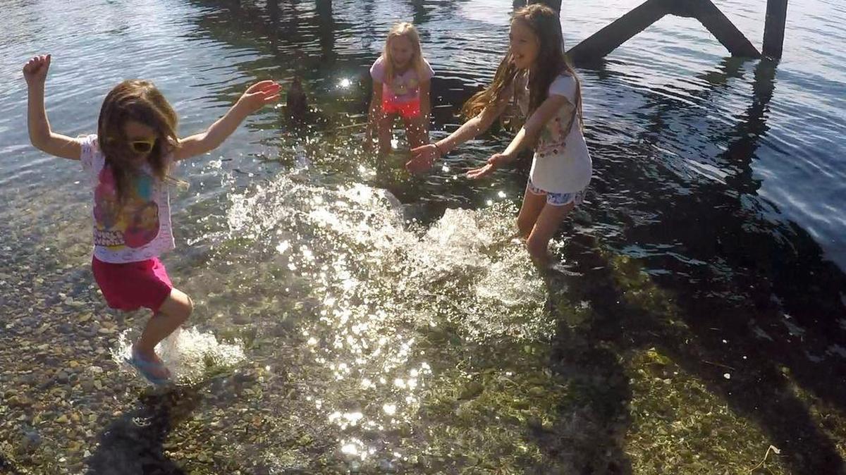 Bailey Urdiales, 6, left, Juila Muirhead, 10, and Bailey’s sister Treilyn Urdiales, 10, play in Bellingham Bay at Boulevard Park during the hot weather Monday, April 18, 2016. Wednesday, was the fourth day in a row Bellingham set a high temperature record.