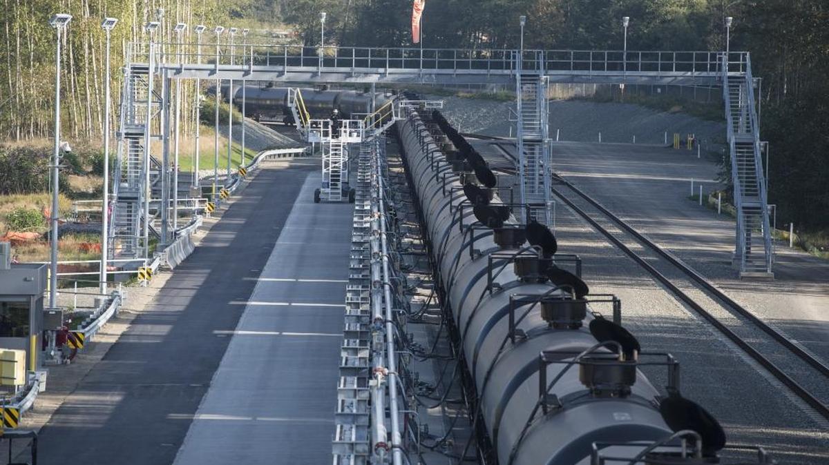Savage Services employees offload crude oil from a train on Oct. 8, 2014, at the BP Cherry Point Refinery rail loop.