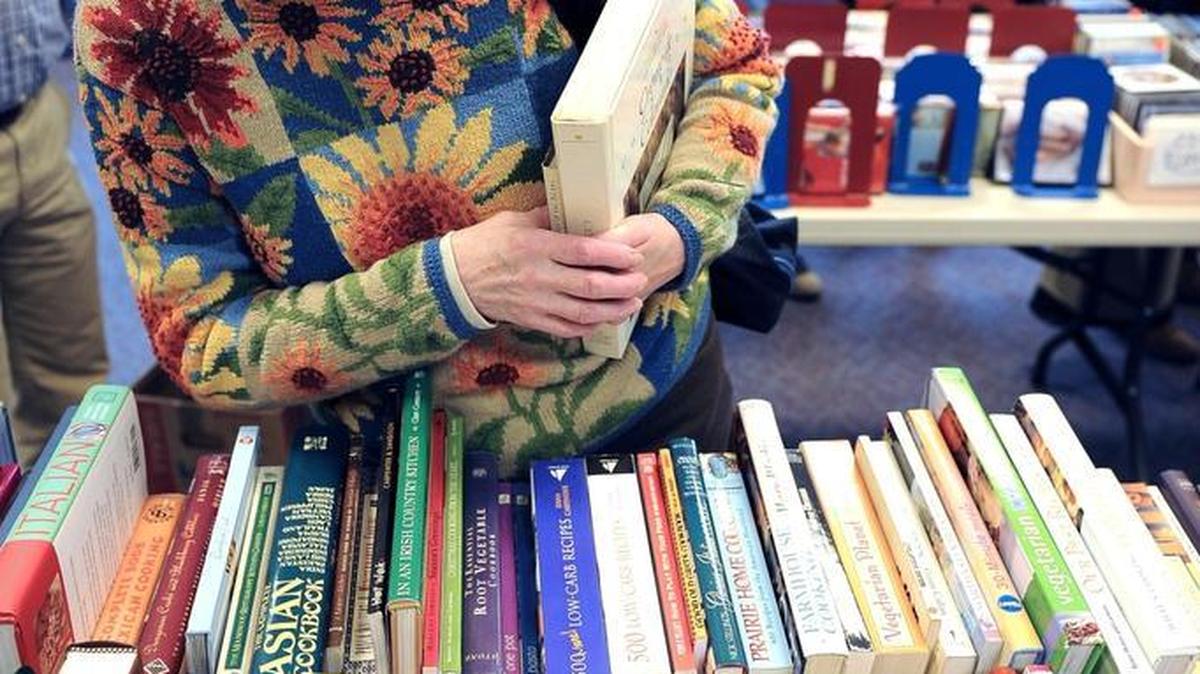 Readers browse the selection of used books at a Friends of the Bellingham Public Library sale in 2015.