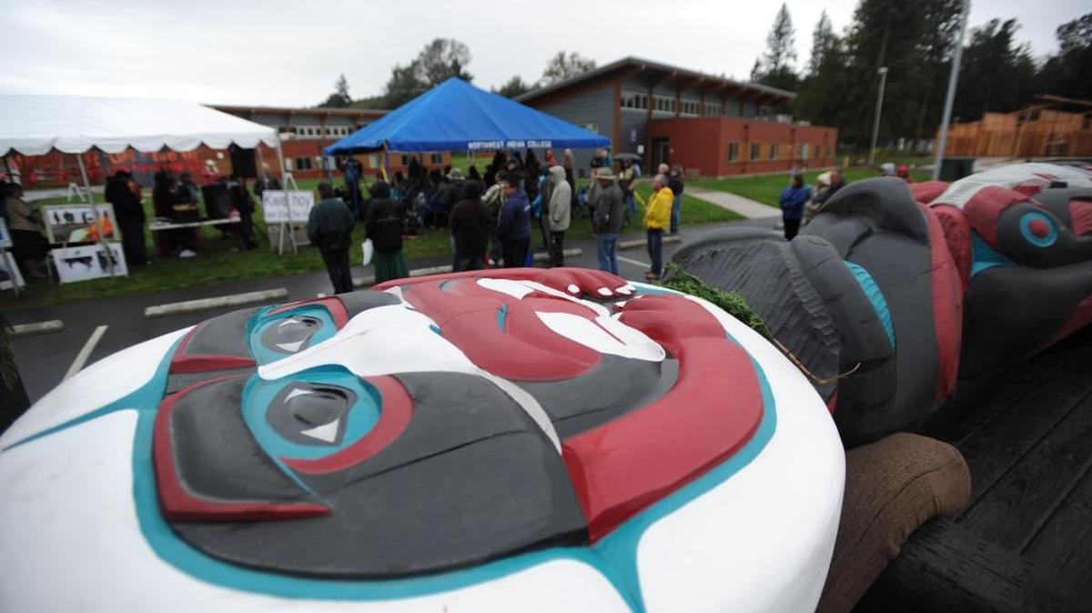 A large crowd gathers at Northwest Indian College to welcome a healing pole created by Lummi carver Jewell James and the House of Tears carvers on Sept. 27, 2015. The pole was carved in opposition to the proposed Gateway Pacific Terminal; a site Lummi leaders say is a sacred home of their ancestors as well as an important present-day fishing area.