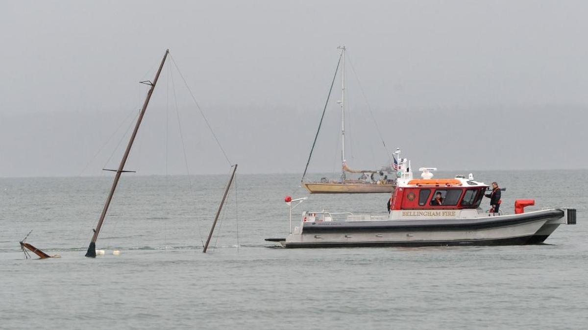 The Bellingham Fire Department fire boat checks on a sunken sailboat off the end of Cornwall Avenue in Bellingham Bay on Monday morning, March 7, 2016.