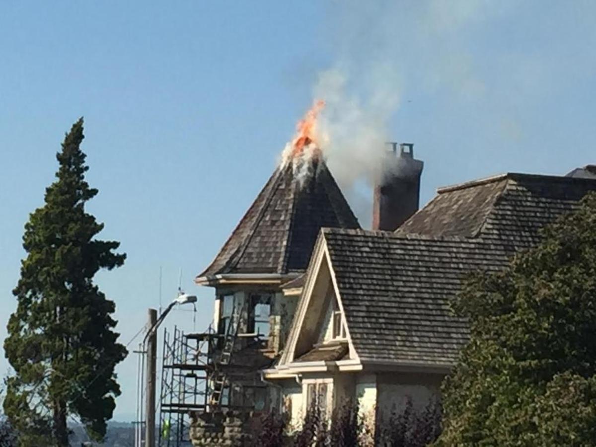 Crews contained the fire at this house, 158 S. Forest St., to the roof and turret area. Cause of the Monday afternoon fire remains under investigation.