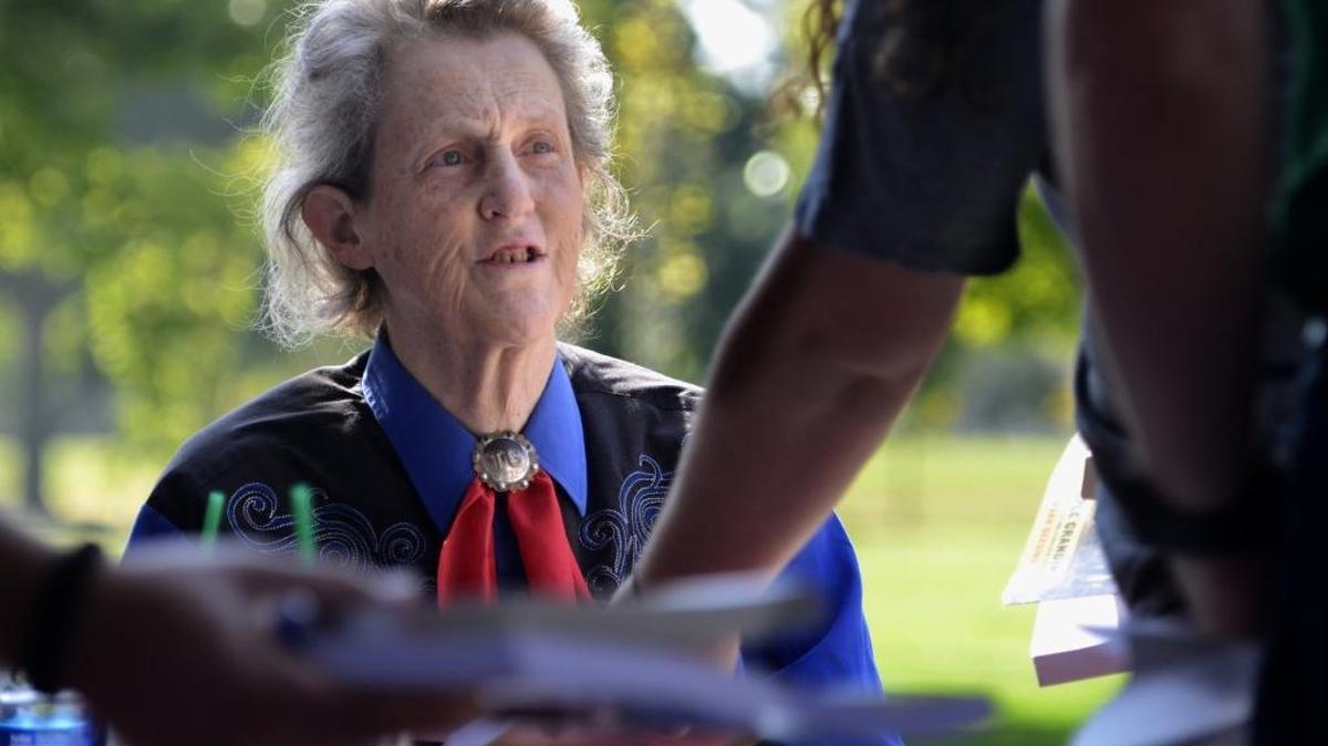 Temple Grandin, a renowned professor of animal science and autism advocate, chats with attendees during a book signing in Fresno, Calif., Sept. 9, 2016. Grandin is scheduled to give a free talk at Western Washington University on Tuesday.