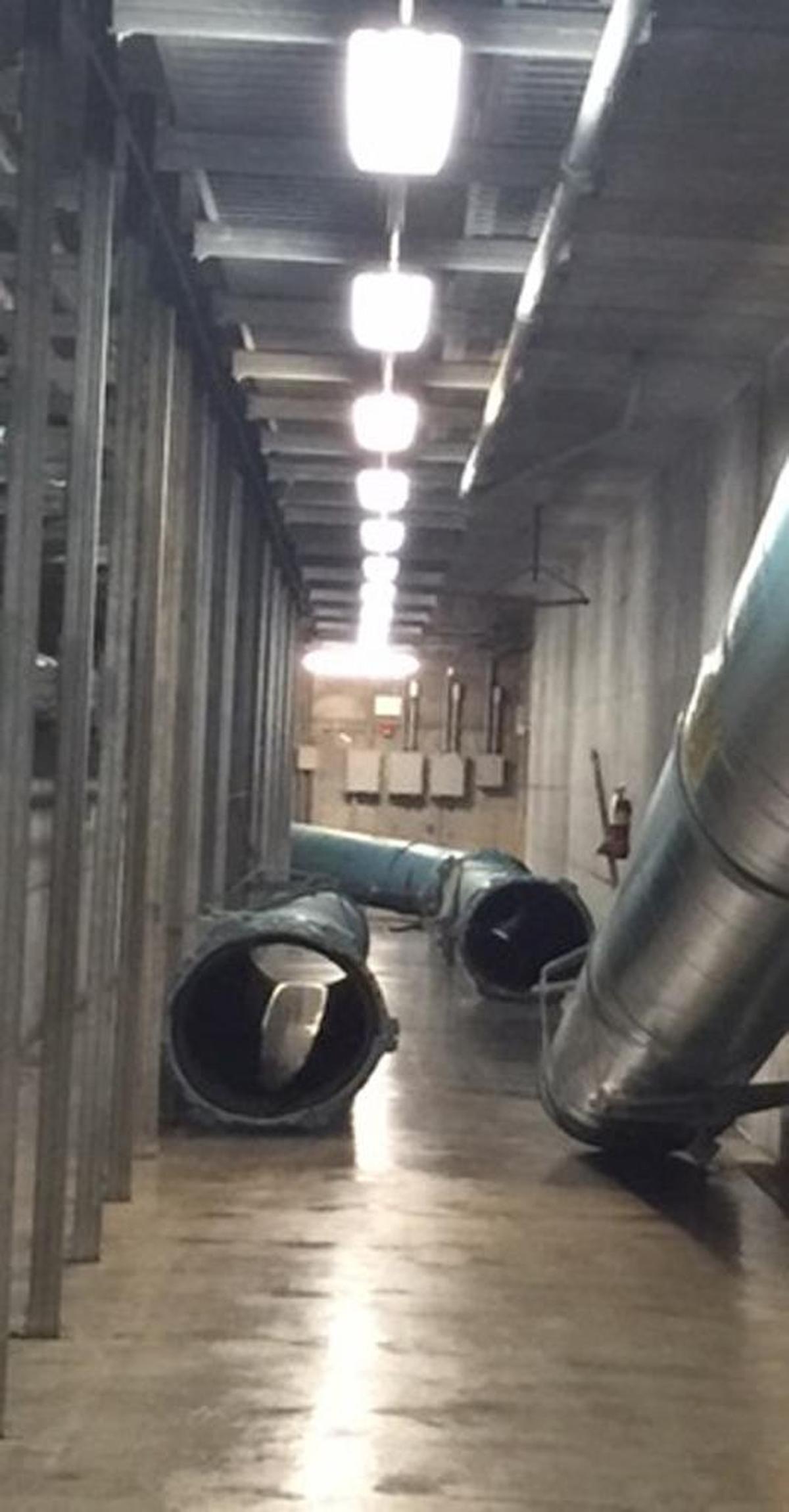 A photo taken Sunday morning shows the broken pipe after floodwaters were pumped out and the area cleaned and disinfected.