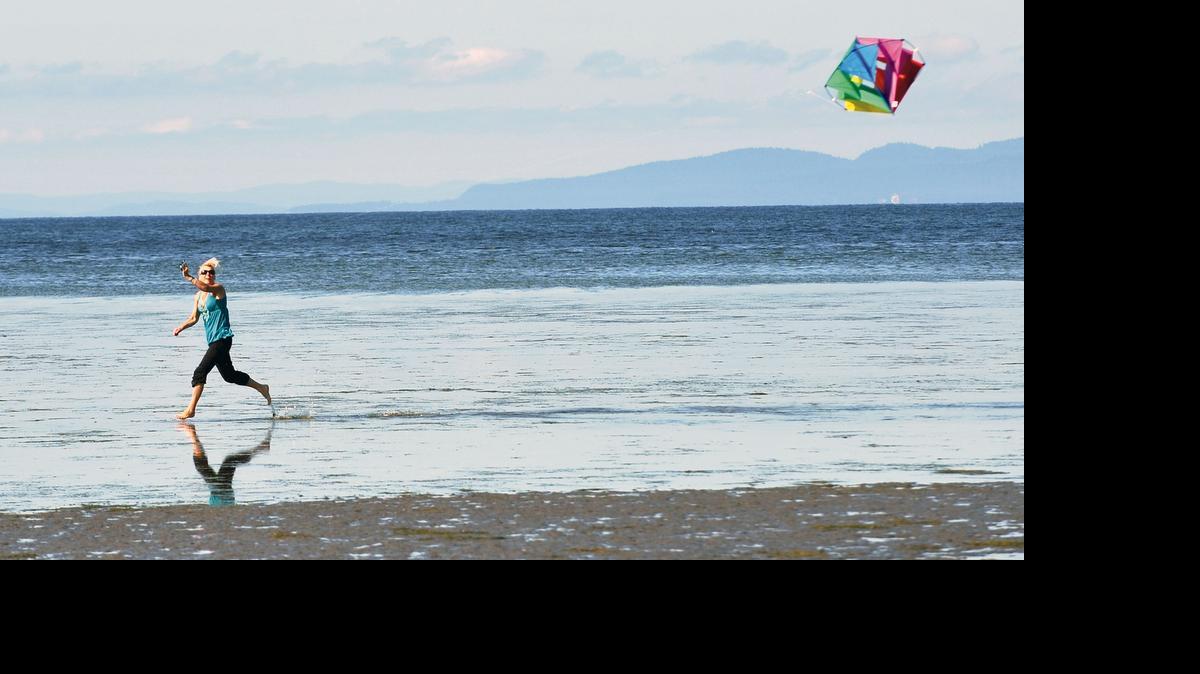 
Louise Roberts uses the Birch Bay tideflats as a runway to fly a kite Monday morning Aug. 1, 2011. Roberts and her family were visiting from Vancouver, B.C.
