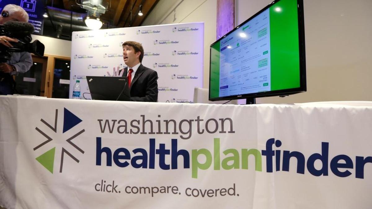 Brad Finnegan demonstrates the Washington Healthplanfinder website, where consumers will be able to shop for health insurance, following a news conference Sept. 30, 2013, in Seattle.